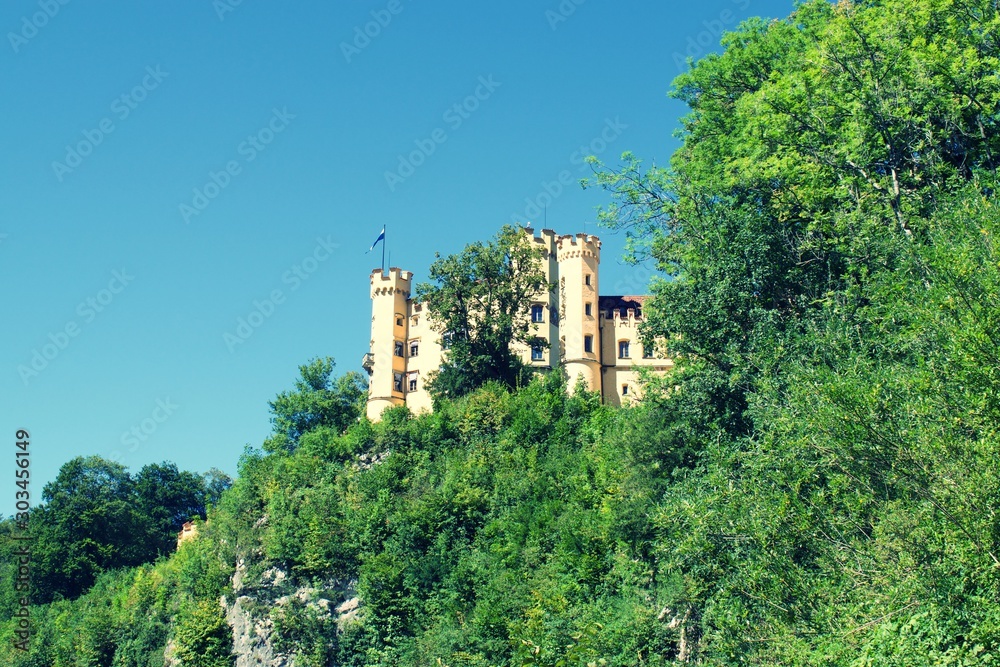 View of Lugwig II Castle Hohenschwangau in Germany, on side of cliff