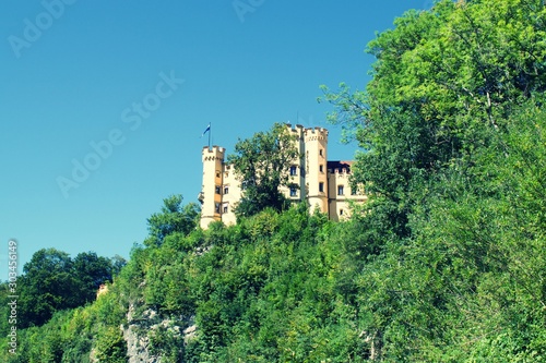 View of Lugwig II Castle Hohenschwangau in Germany, on side of cliff