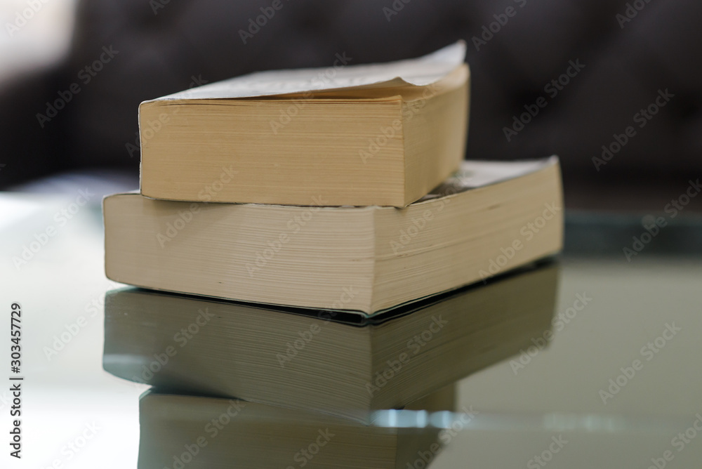 Stack of books on wooden table with copy space. Education background. Back to school concept Stack of books on wooden table with copy space. Education background. Back to school concept
