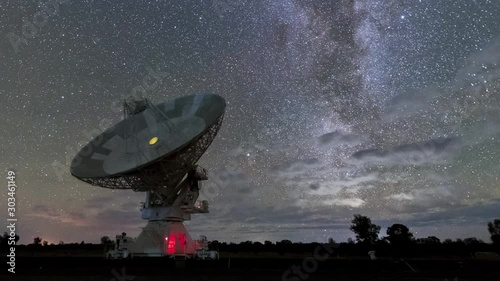 A timelapse clip of the CSIRO satellites in NSW Australia exploring the skies with the Milkyway and stars moving. This is a great tourist spot with dark skies and impressive engineering. photo