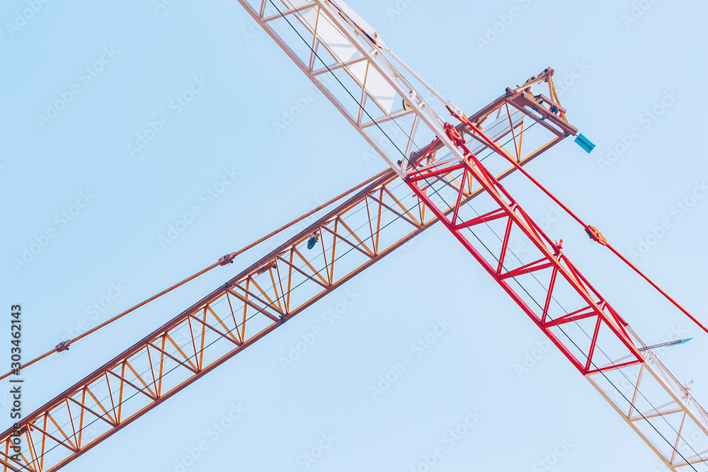 The boom of a construction crane on sky background The boom of a construction crane on sky background