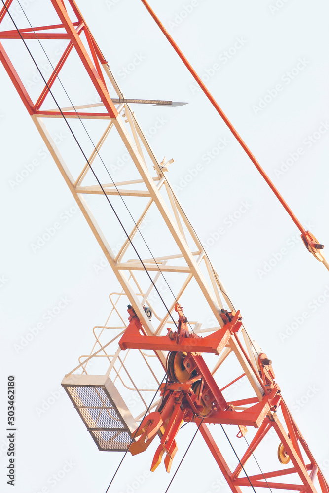 The boom of a construction crane on sky background The boom of a construction crane on sky background