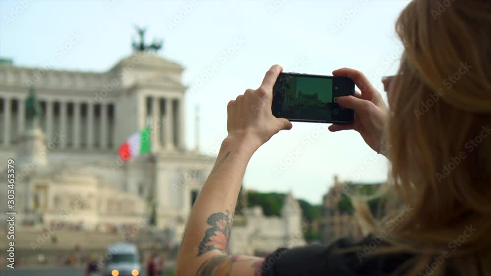 Caucasian woman takes photo of historic Rome Building with phone, slow motion Caucasian woman takes photo of historic Rome Building with phone, slow motion