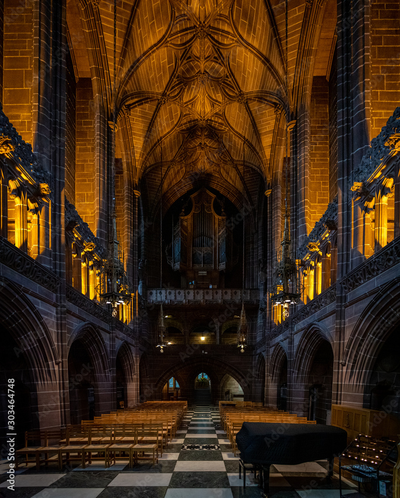 LIVERPOOL, ENGLAND, DECEMBER 27, 2018: The Lady Chapel in Liverpool Anglican Cathedral. Panoramic view of a magnificent part inside the church, where light meets darkness all along place.