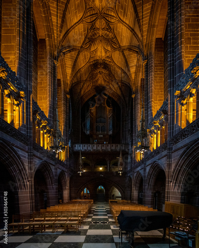 LIVERPOOL, ENGLAND, DECEMBER 27, 2018: The Lady Chapel in Liverpool Anglican Cathedral. Panoramic view of a magnificent part inside the church, where light meets darkness all along place. © Andres Conema