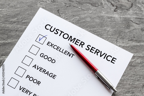 Customer service form with mark Exellent close up on grey background top view photo