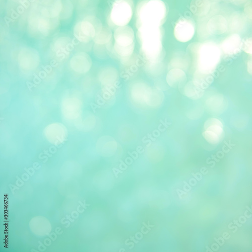 Soft focus bokeh light effects over a rippled