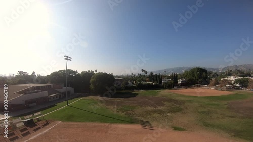 Pull back above baseball diamond at Poinsettia Recreation Center in West Hollywood, California 4K photo