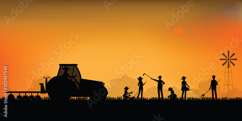 Silhouette of farmer driving a tractor.