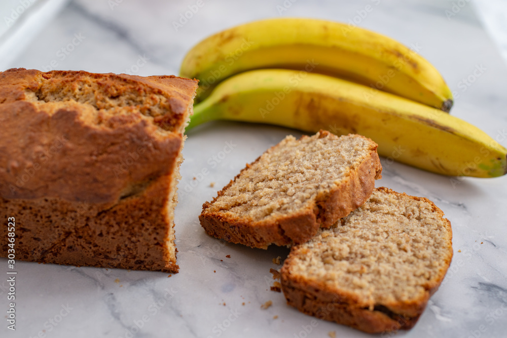 Healthy home made banana bread or cake for breakfast on a table Healthy home made banana bread or cake for breakfast on a table
