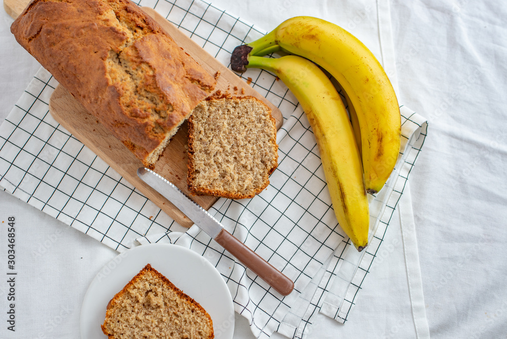 Healthy home made banana bread or cake for breakfast on a table Healthy home made banana bread or cake for breakfast on a table