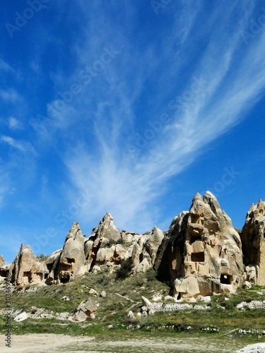 Natural fairy chimneys rock formation in Goreme in Turkey on a beautiful sunny day. Goreme is an international tourism attraction and a region of exceptional natural wonders.