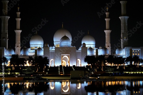 grand mosque and water reflection at night in abu dhabi at night united arab emirates