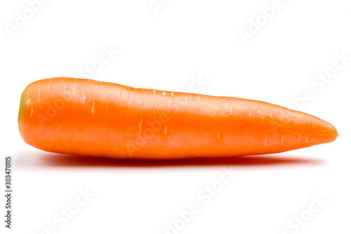 Fresh carrot laid along the length on white background.