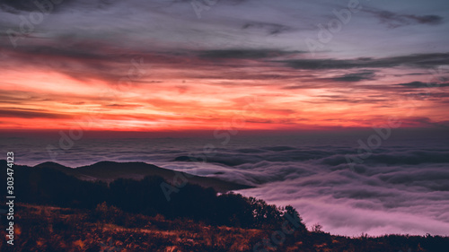 Sunrise over see of clouds