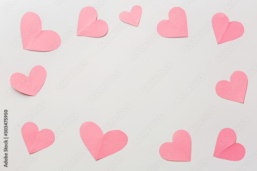 Valentine's day background with pink hearths on white. Flat lay, top view, mockup, template, copy space. Minimal abstract composition for 14 February celebration