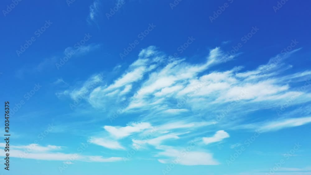 Poetic inspiration of sky with blue gradient colors and frozen veil of clouds moving slowly over tropic Poetic inspiration of sky with blue gradient colors and frozen veil of clouds moving slowly over tropic
