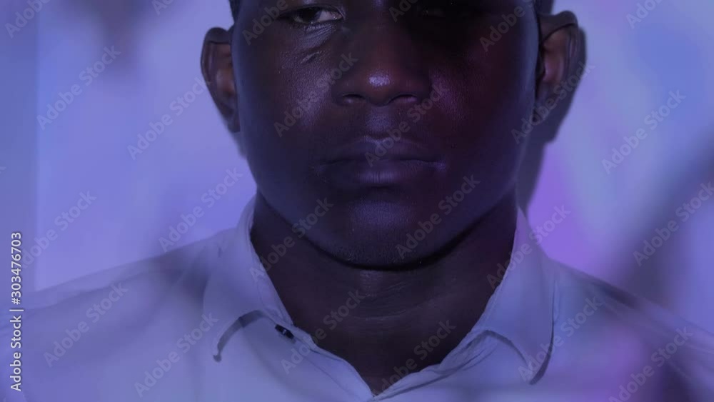 depressed lonely american african man in the disco with psychedelic lights depressed lonely american african man in the disco with psychedelic lights