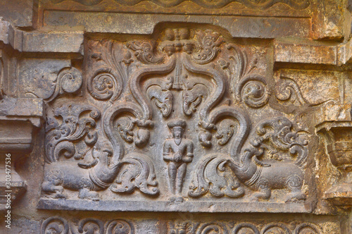 Carved sculpture on the wall of Kopeshwar Temple, Khidrapur, Maharashtra, India photo