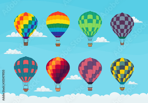 Set of brightly colored hot air balloons in the sky with clouds. Icon design. Vector.
