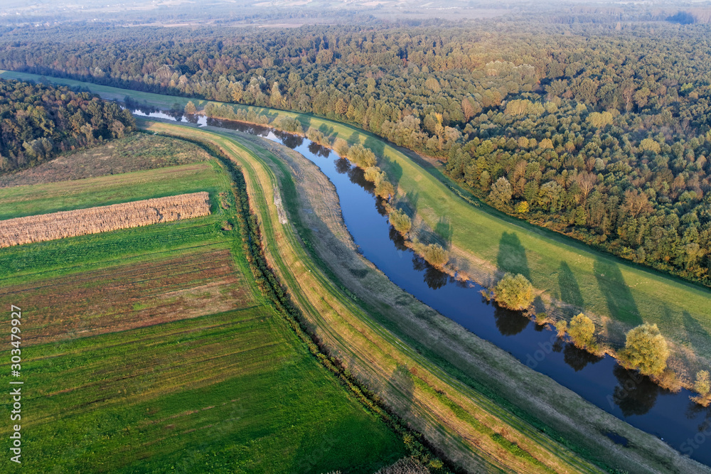 Regulated river with the dikes in continenal Croatia
