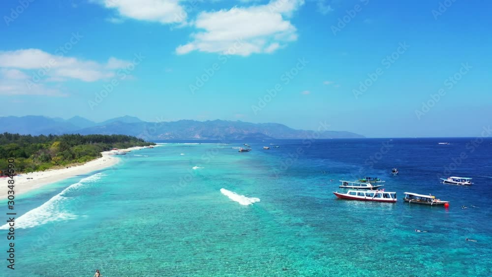 The Busy Island Of Maldives With Tourists Enjoying The Sun Under A Clear Blue Summer Sky- Aerial Shot The Busy Island Of Maldives With Tourists Enjoying The Sun Under A Clear Blue Summer Sky- Aerial Shot