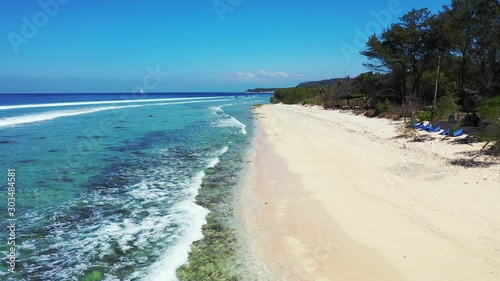 Falalop Island In Ulithi Atoll, Federated States Of Micronesia - Waves Calmly Splashing On Its White Sandy Shore Lined With Green Trees - Close-up Shot photo