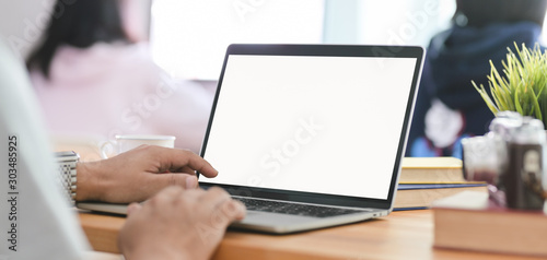 Cropped shot of businessman typing on laptop computer in comfortable workplace