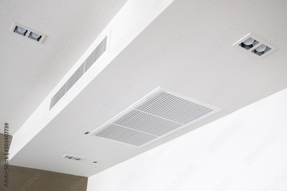 Ceiling mounted cassette type air conditioner. Stock Photo | Adobe Stock