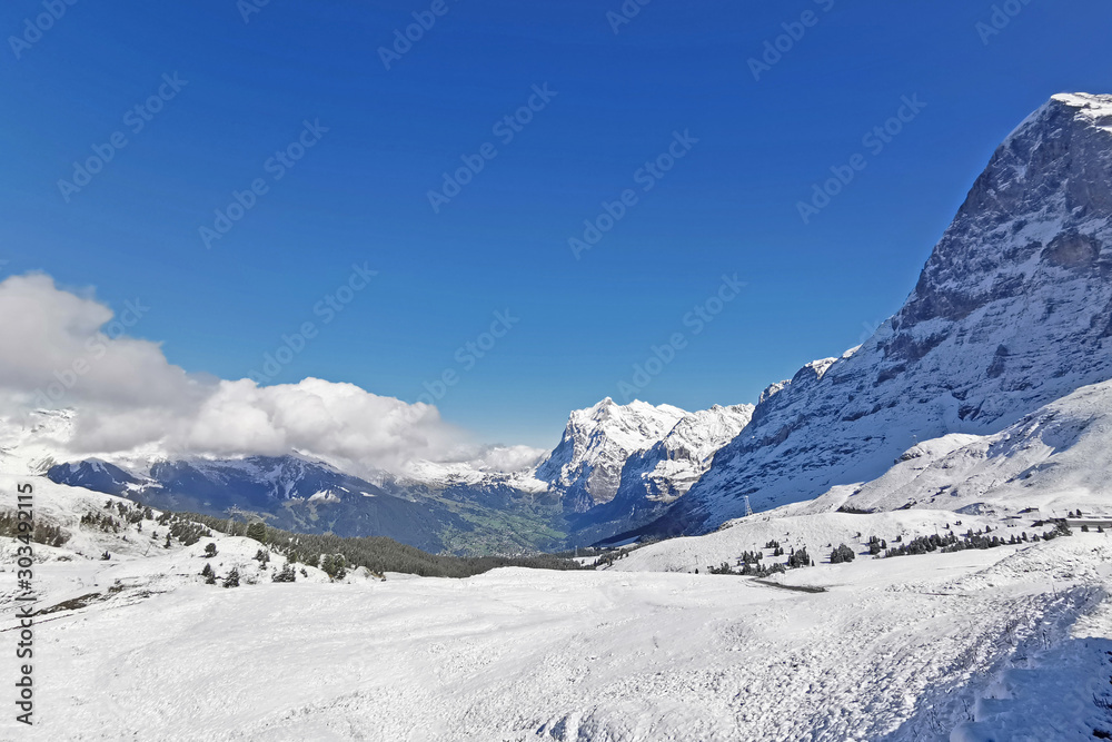 Peak of Switzerland Grindelawld snow mountain with blue sky.