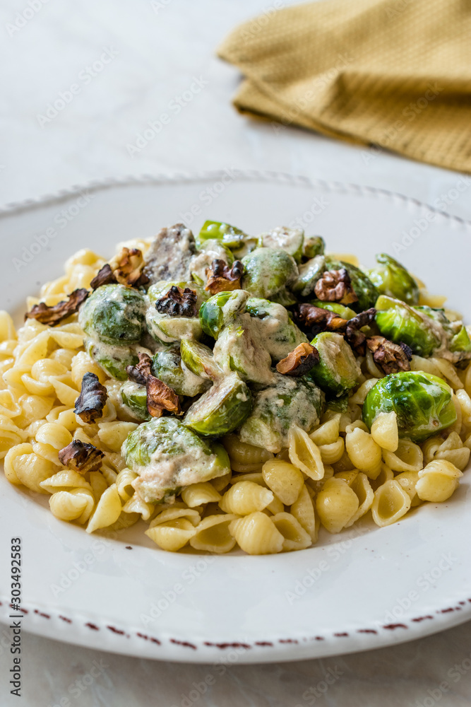 Conchiglie / Conchiglioni Homemade Pasta with Brussel Sprouts, Milk Sauce and Walnuts.