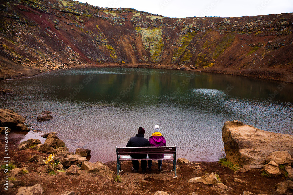 Kerid volcanic crater lake in Iceland. Landscape with red volcanic stones on the top of Kerid Crater with blue crater lake in Iceland Kerid volcanic crater lake in Iceland. Landscape with red volcanic stones on the top of Kerid Crater with blue crater lake in Iceland