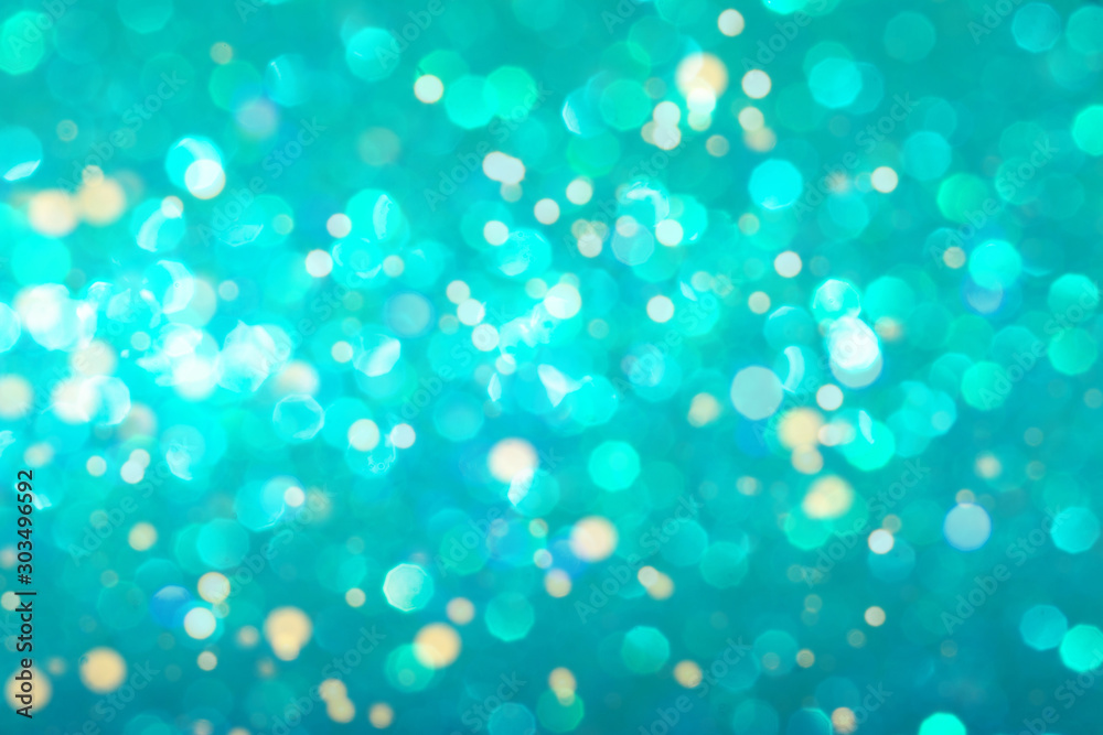 Mint festive background with sparkles in the bokeh. The concept of the celebration, the day of St. Valentine, New Year, birthdays, ceremonies, events, etc.