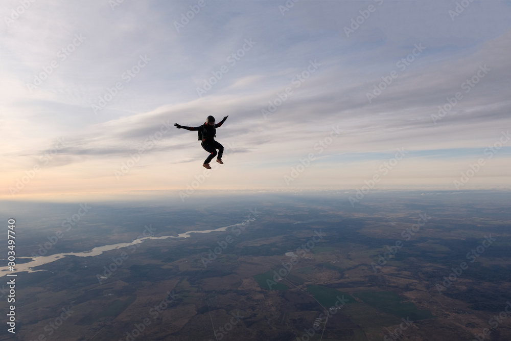 Skydiving. A solo skydiver is flying in the sky Skydiving. A solo skydiver is flying in the sky