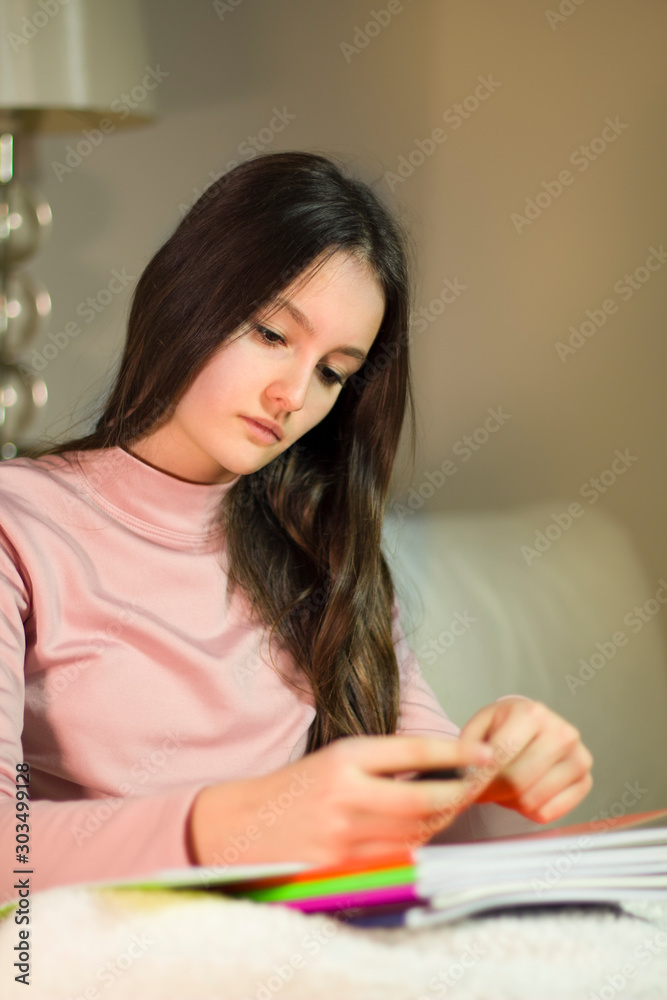 Teenage girl doing homework for school. Teenage girl doing homework for school.