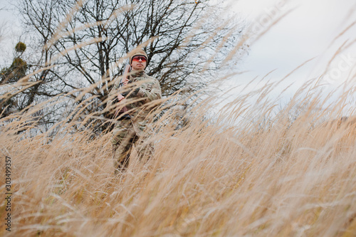 Hunting permit. Man brutal gamekeeper nature background. hunter spend leisure hunting. Hunter hold riffles. Focus and concentration of experienced hunter. Hunting and trapping seasons.