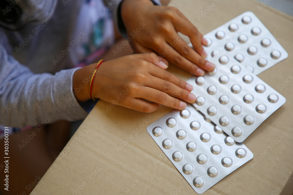 Methylphenidate ( Ritalin ) of Psychostimulants on Girl's hand on ...