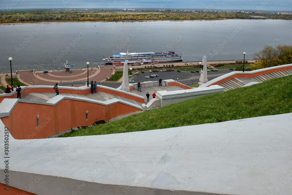 NIZHNY NOVGOROD, RUSSIA - SEPTEMBER 28, 2019:  View on the Nizhne-Volzhskaya Embankment and the Chkalov Stairs from the Nizhny Novgorod Kremlin