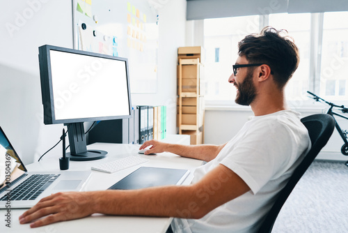 Graphic designer working on computer in office