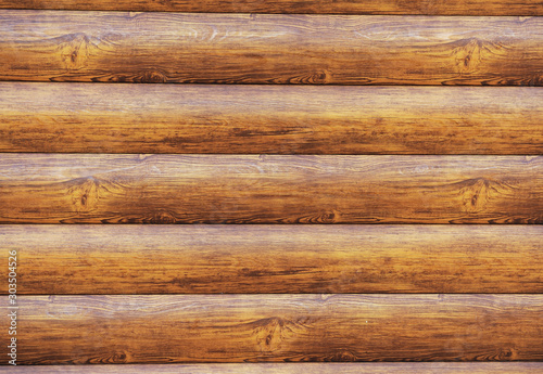 Metal lining on the facade of the building imitating the texture of wood.Element of the facade. Part of the facade decoration close-up. Facing material of buildings. Metal sheet roof.