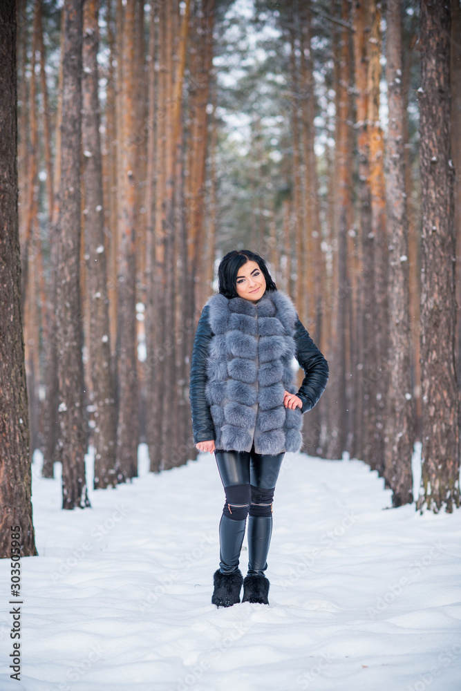 Winter holidays concept. Arabic woman in stylish look at snowy day outside Winter holidays concept. Arabic woman in stylish look at snowy day outside