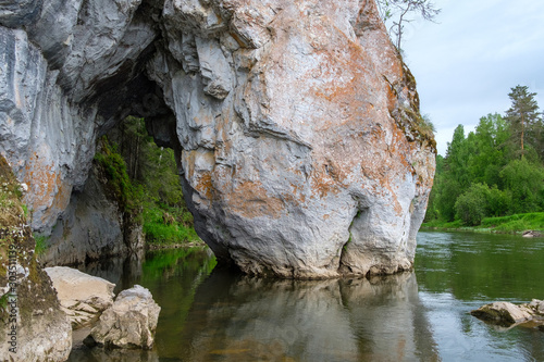 rock standing in the water in two parts between them you can swim on the river © metelevan