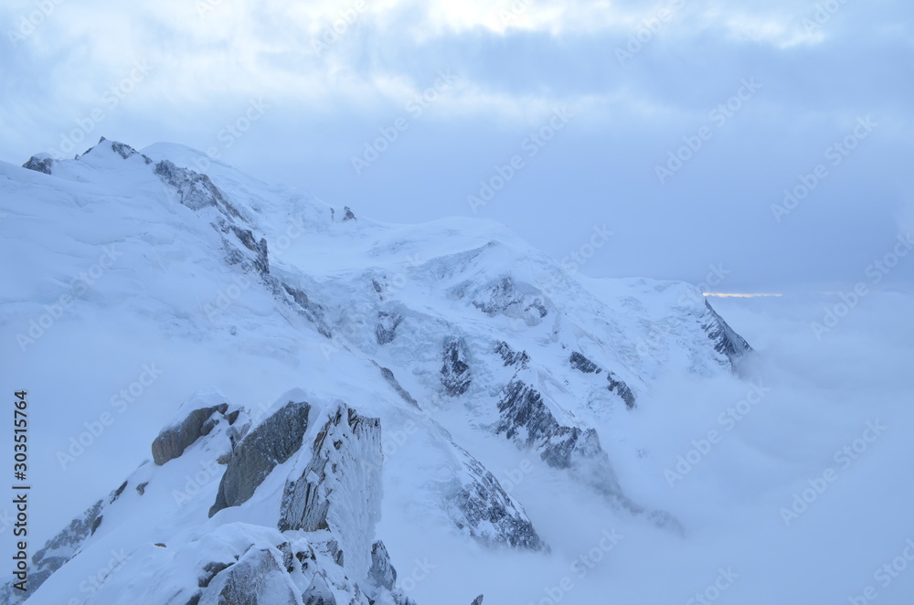 mountain top panorama French alps greyscale overcast rocks snow vista