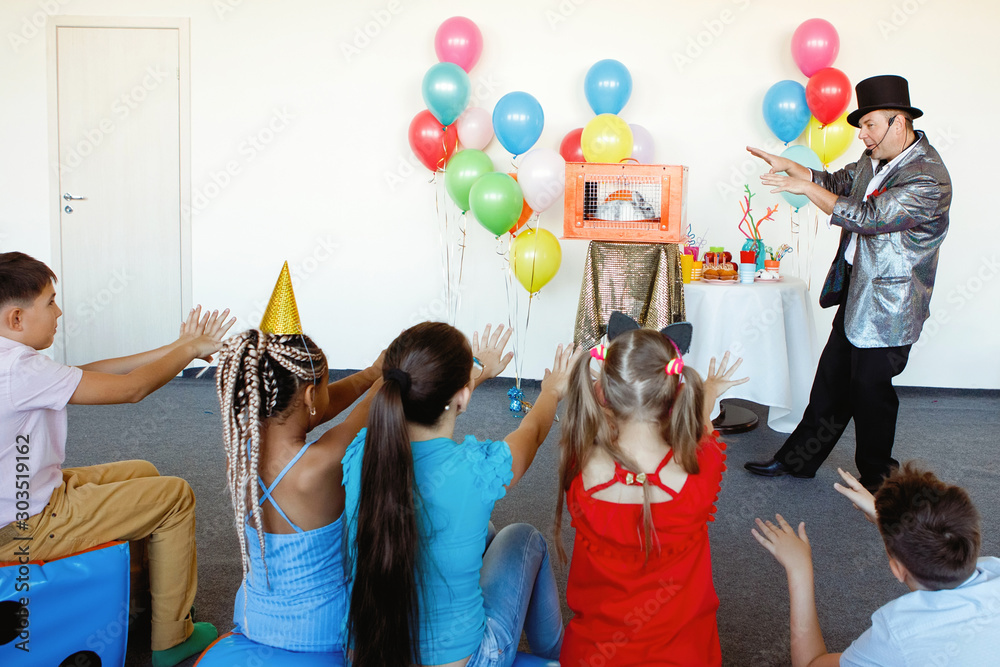 Magician, an illusionist shows tricks.