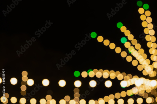 street festival night glitter sparkle light blurred bokeh background with beautiful magic colors