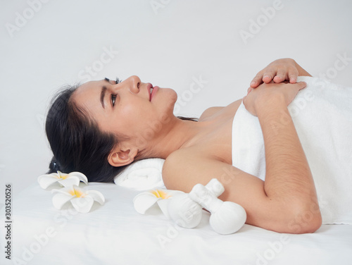 Young woman and spa accessories on massage table
