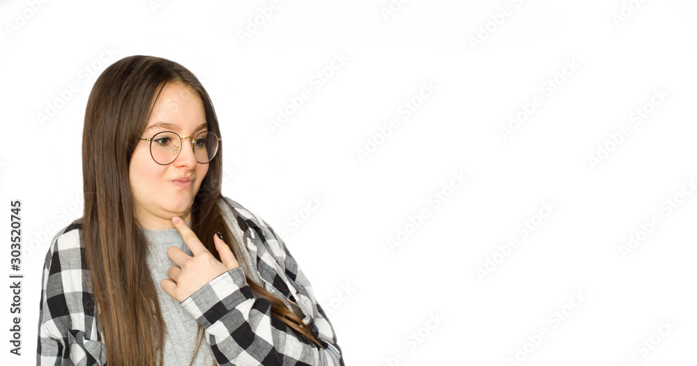 Cute young girl making funny face over white background. Copy space. Cute young girl making funny face over white background. Copy space.