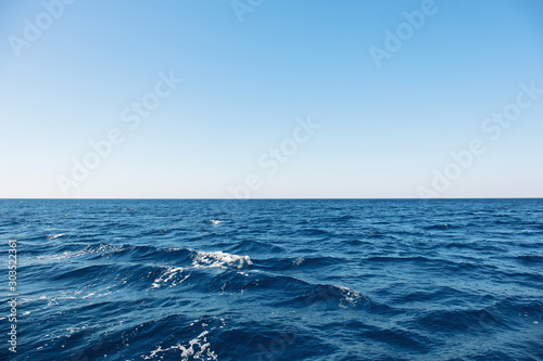 Fototapeta Naklejka Na Ścianę i Meble -  Blue sea surface with waves and horizon