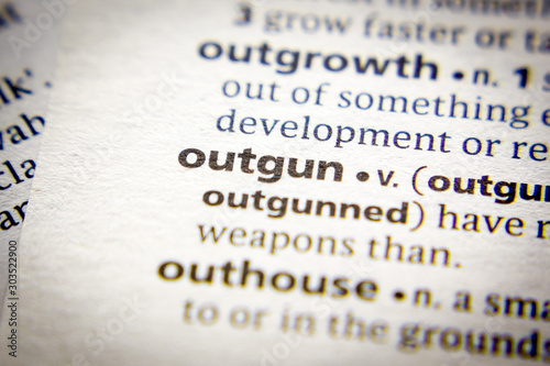 Word or phrase Outgun in a dictionary. photo