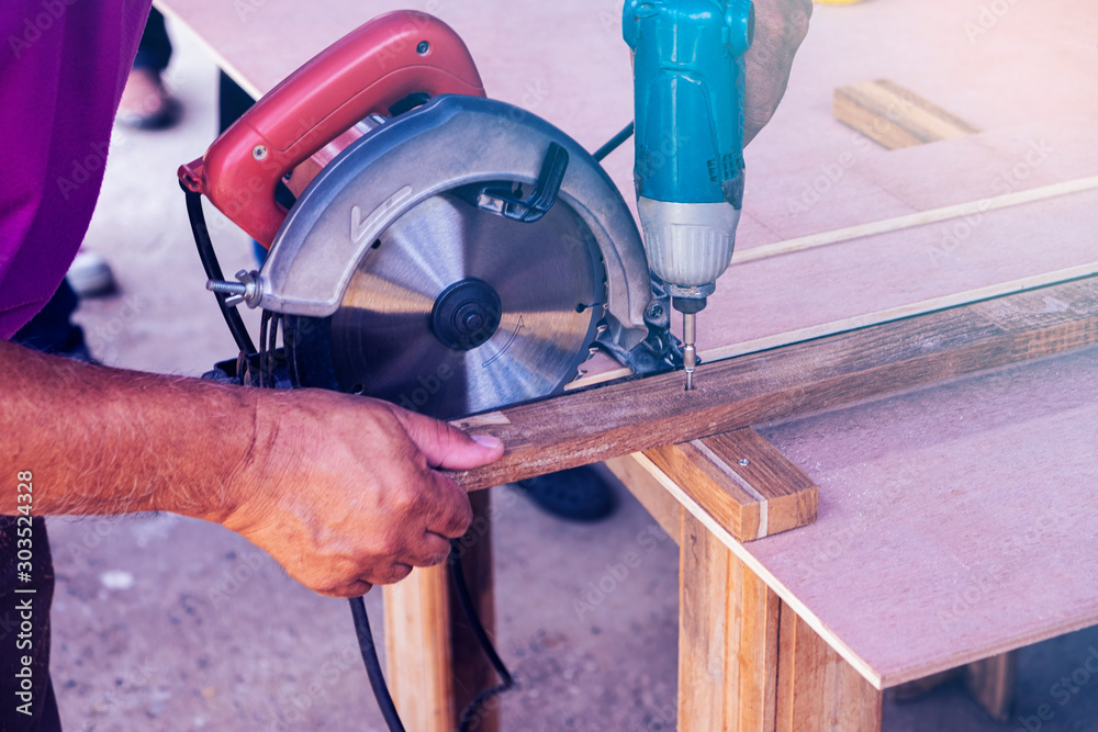 Blurred for background.Cutting wood hand power saw. Blurred for background.Cutting wood hand power saw.